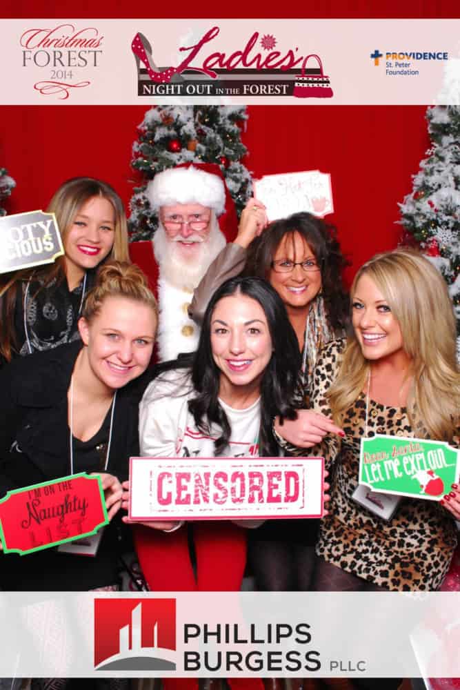 Five women posing with Santa at the Christmas Forest Ladies night out 