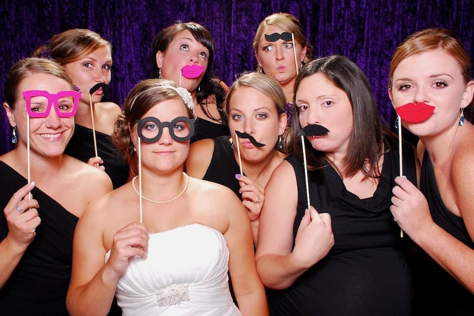 a new bride and her bridesmaids wedding photo booth 