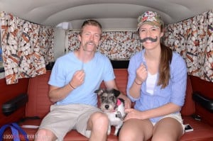 Couple with a dog in a VW Van
