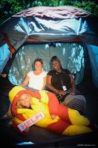 three women in a tent photo booth activation