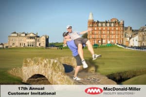 two golfers posing on the old bridge at St Andrews Scotland
