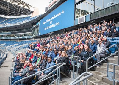 300 Alaska airlines employees posing for a group photo in Centurylink field