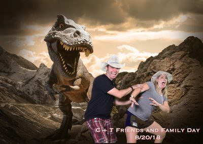 Man and women running from dinosaur.